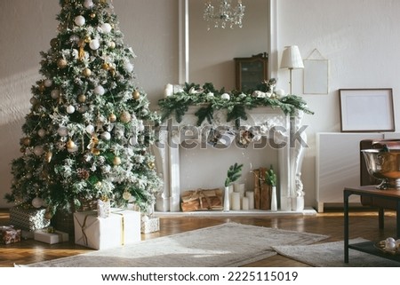 Christmas interior in retro style. White fireplace and mirror with christmas tree garland.