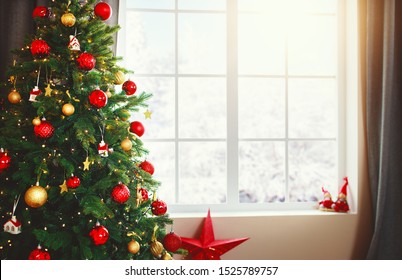 Christmas Interior Tree With Gifts Near The Window At Home
