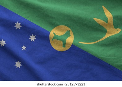 Christmas island flag depicted on folded wavy fabric of old cloth close up - Powered by Shutterstock