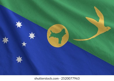 Christmas island flag depicted on folded wavy fabric of old cloth close up - Powered by Shutterstock