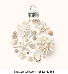 Christmas In July / At The Beach / In The Southern Hemisphere Concept With Holiday Ornament Made Of Shells, Starfish And Corals On A Cream Colored Background, Flat Lay / Top View, Copy Space For Text