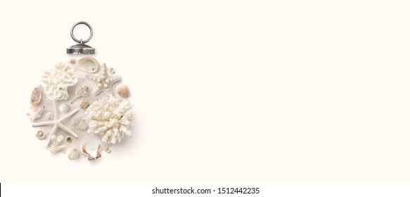 Christmas In July / At The Beach / In The Southern Hemisphere Conceptual Banner, Background Or Header / Hero Image With Holiday Ornament Made Of Shells, Starfish And Corals, Flat Lay, Copy Space