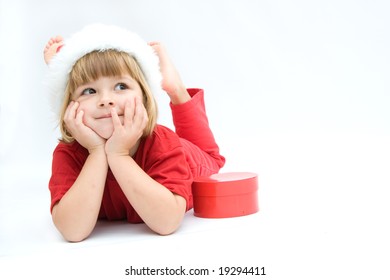 Christmas Kid In Santa Hat On White Background