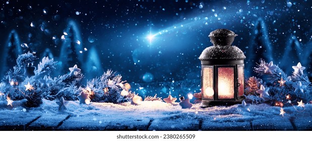 Christmas lamp shining with warm light against the background of a winter forest and the night sky with a bright shooting star - Powered by Shutterstock