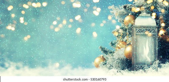 Christmas lantern with Christmas decoration on the snow - Powered by Shutterstock