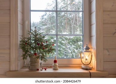 Christmas lantern, Christmas gnome, Christmas tree and red decor on the window of a wooden house - Powered by Shutterstock