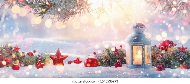  Christmas Lantern On Snow With Fir Branch in the Sunlight. Winter Decoration Background - Powered by Shutterstock