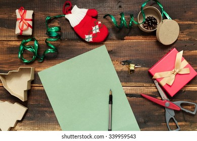 Christmas Letter Writing On Green Paper On Wooden Background With Decorations