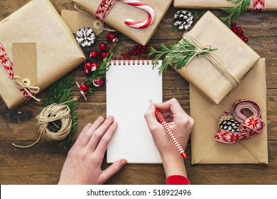 Christmas Letter Writing On Paper On Wooden Background With Decorations