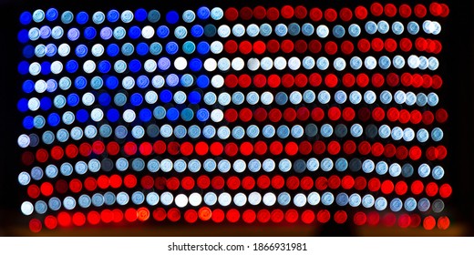 Christmas Lights American Flag Bokeh.  July 4 Independence Day Holiday In The United States. Patriotic US Blur Background. Merry Christmas And Happy New Year.