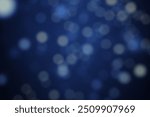 Christmas lights in bokeh. Outside in December. Snow and blue bokeh on a black background, bokeh abstract background, modern technological abstract background. Blue Christmas background, Xmas bokeh
