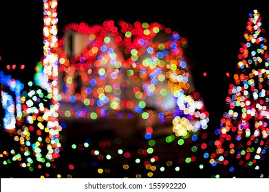 Christmas lights with house and Christmas tree as a background