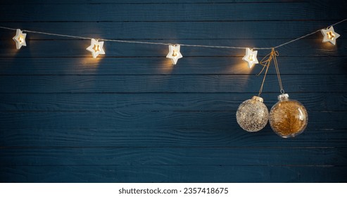 Christmas lights on blue wooden background - Powered by Shutterstock