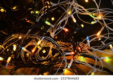 Christmas lights on the wooden table, dark background - Powered by Shutterstock