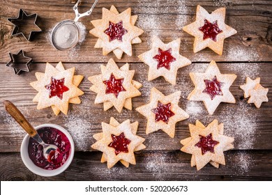 Christmas Linzer cookies with raspberry jam on a rustic wooden background - Powered by Shutterstock