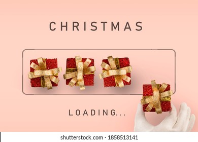 Christmas loading - boxes with gifts are laid out by Santa Claus hand. Waiting for the new year holiday concept. Pink background.