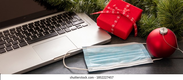 Christmas Lockdown, Office Closed, Covid 19 Pandemic. Protective Mask And Xmas Ornaments On Blue Wood Background, Season Holiday Business Desk, Banner