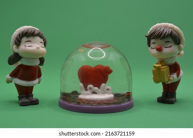 Christmas love couple with snowglobe