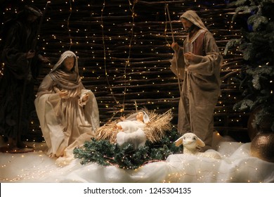 Christmas Manger scene with figures including Jesus, Mary, Joseph, sheep and magi.