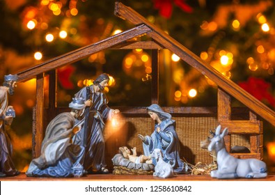 Christmas Manger scene with figurines including Jesus, Mary, Joseph and sheep.  - Powered by Shutterstock
