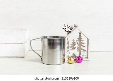 Christmas Metal Mug Mockup. Camping Mug With Christmas Attributes.