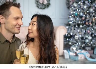 Christmas Mixed Race Couple Cheers Together Near Ornate Festive Eve. Holidays Celebrations Family Together