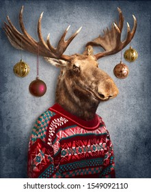 Christmas Moose With Christmas Balls Hanging On Antlers. Concept Graphic, Photo Manipulation For Cover, Christmas Card, Advertising, Prints On Clothing And Other.