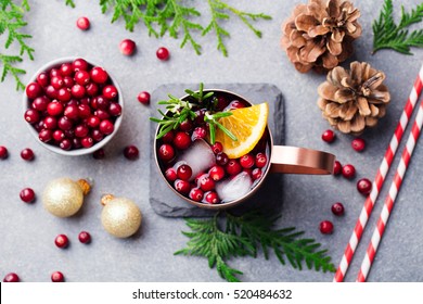 Christmas Moscow Mule, Holiday Drink In A Copper Mug. Grey Stone Background. Top View.