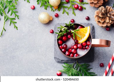 Christmas Moscow Mule, Holiday Drink In A Copper Mug. Grey Stone Background. Top View. Copy Space.