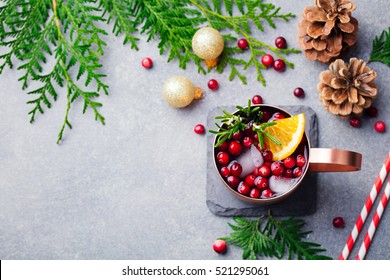 Christmas Moscow Mule, Holiday Drink In A Copper Mug. Grey Stone Background. Top View. Copy Space.