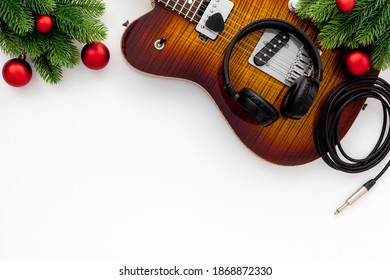 Christmas Music. Flat Lay Composition With Guitar And Fir Tree Branches 