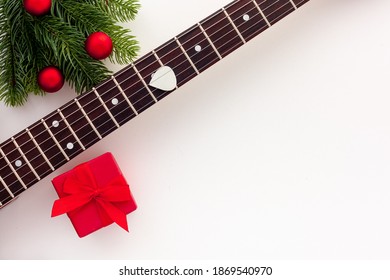 Christmas Music. Flat Lay Composition With Guitar And Fir Tree Branches 