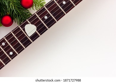 Christmas Music. Flat Lay Composition With Guitar And Fir Tree Branches 