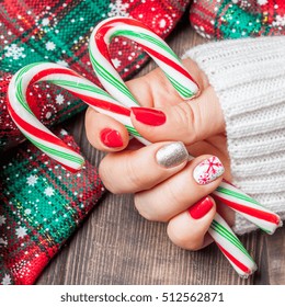 Christmas Nail Art Manicure. Winter Holiday Style Bright Manicure With Gems Christmas Tree And Snowflakes