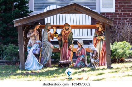 A christmas nativity decortation on a front lawn celebrating the holiday in daylight. - Powered by Shutterstock