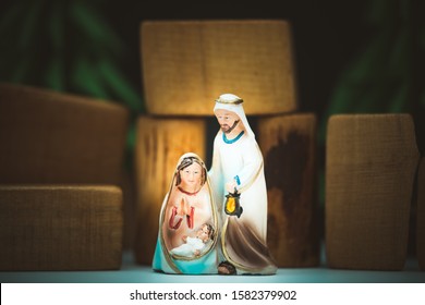 Christmas Nativity Scene Of Born Child Baby Jesus Christ In The Manger With Joseph And Mary.Traditional Christmas Nativity Scene Of Baby Jesus In The Manger With Mary And Joseph.