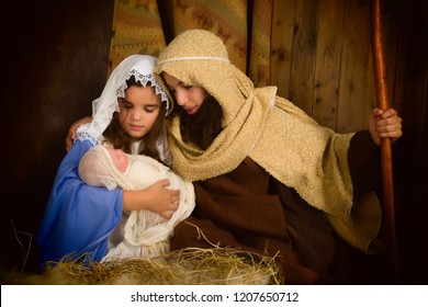 Christmas nativity scene reenacted by children and a doll