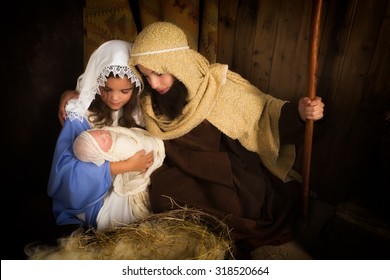 Christmas Nativity Scene Reenacted By Children And A Doll