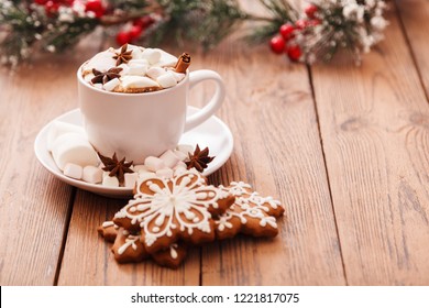 Christmas or New year background. A Cup of festive hot chocolate or cocoa with marshmallows and traditional gingerbread cookies on the table. The concept of advertising cocoa drink. Copy space - Powered by Shutterstock