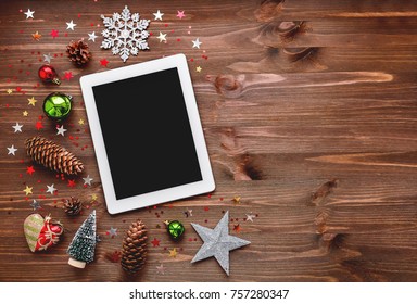 Christmas and New year background with tablet and decorations. Place for text. Mock up, flat lay.