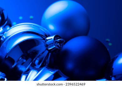 Christmas and New Year blue color baubles decoration background.  Art design backdrop with holiday balls. Beautiful Christmas ball closeup - Shutterstock ID 2396522469