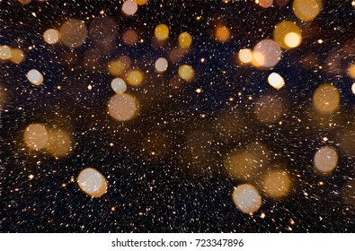 Christmas Or New Year Celebration Background With Golden Glitter Explosion And Bokeh