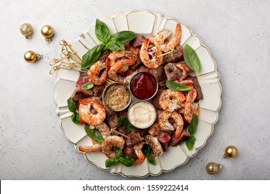 Christmas Or New Year Party Appetizer, Shrimp And Steak With Dipping Sauces Overhead