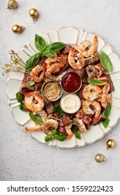 Christmas Or New Year Party Appetizer, Shrimp And Steak With Dipping Sauces Overhead