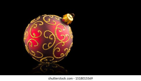 Christmas and New Year Red with gold color Bauble isolated on black background. Holiday bauble decoration. Beautiful Christmas tree ball on black background. - Powered by Shutterstock