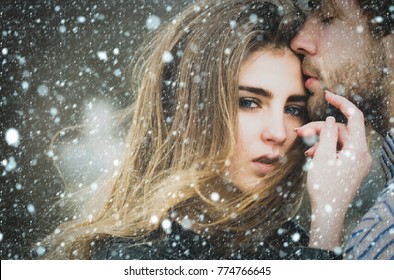 Christmas New Year Snow Concept Sexy Man And Girl With Fashion Makeup And Long Hair Touching Each Other With Love And Tenderness. Young Couple Of Heterosexual Lovers Outdoors