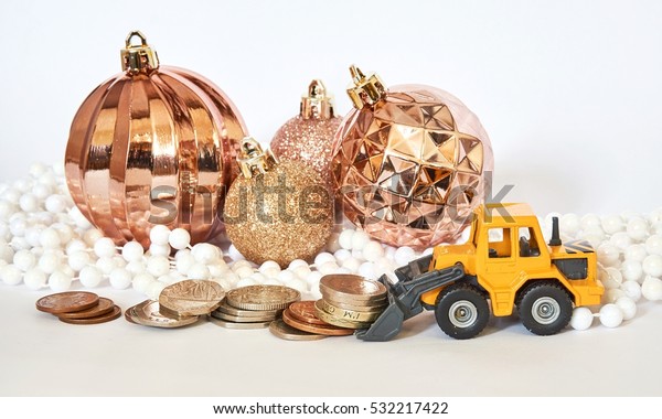 Christmas / New Year spend money\
concept. Money, ornaments, digger and sign on a white\
background.