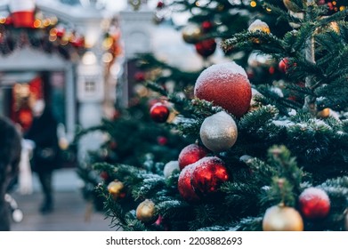 Christmas and New Year time, amazing Xmas decorations on pine trees with real snow, blurred background