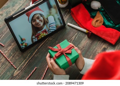 Christmas And New Year  Video Call With Friend With Tablet Exchange Gift Together At Home