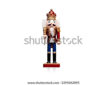 Christmas Nutcracker isolated on white background. Traditional wooden figurine.